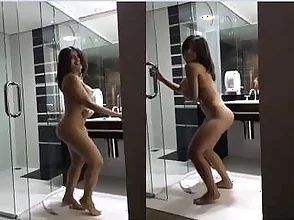 Beautiful woman from overseas performs a sexy nude dance routine.