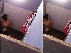 Big-boobed black beauty caught bathing by hidden camera
